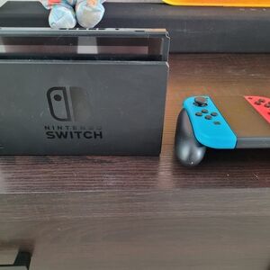 Nintendo Switch Console with Neon Red and Blue Joy-Con